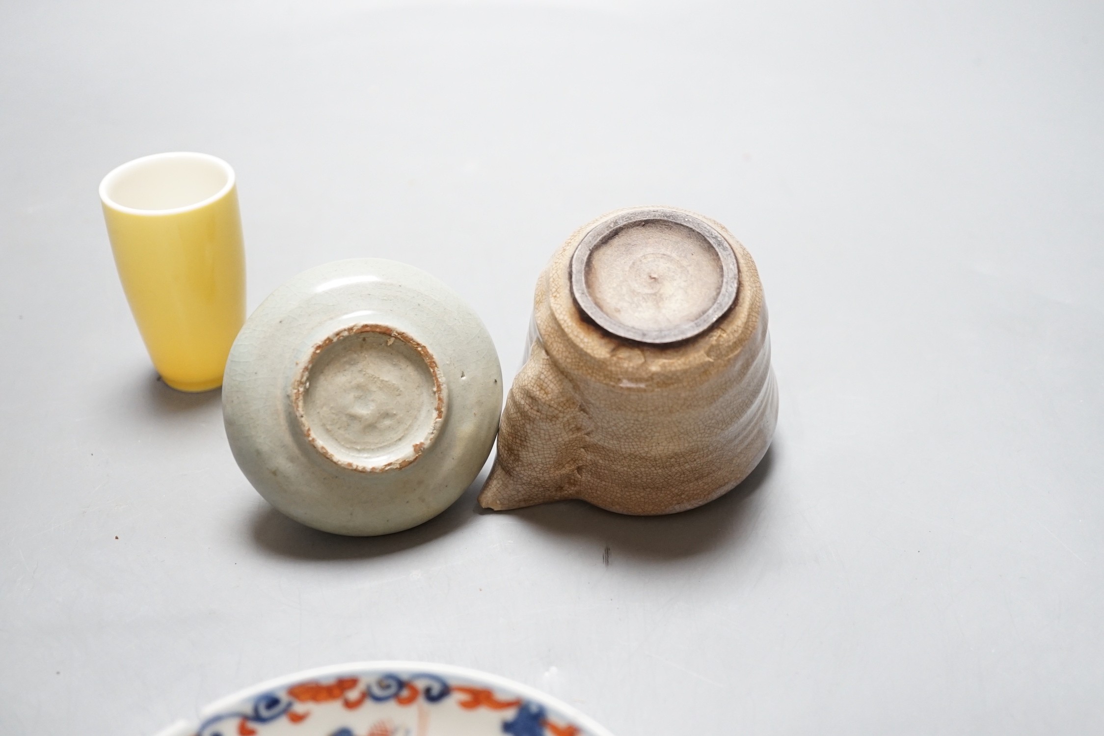 An 18th century Chinese Imari pattern saucer, a small Korean vase and two other pieces